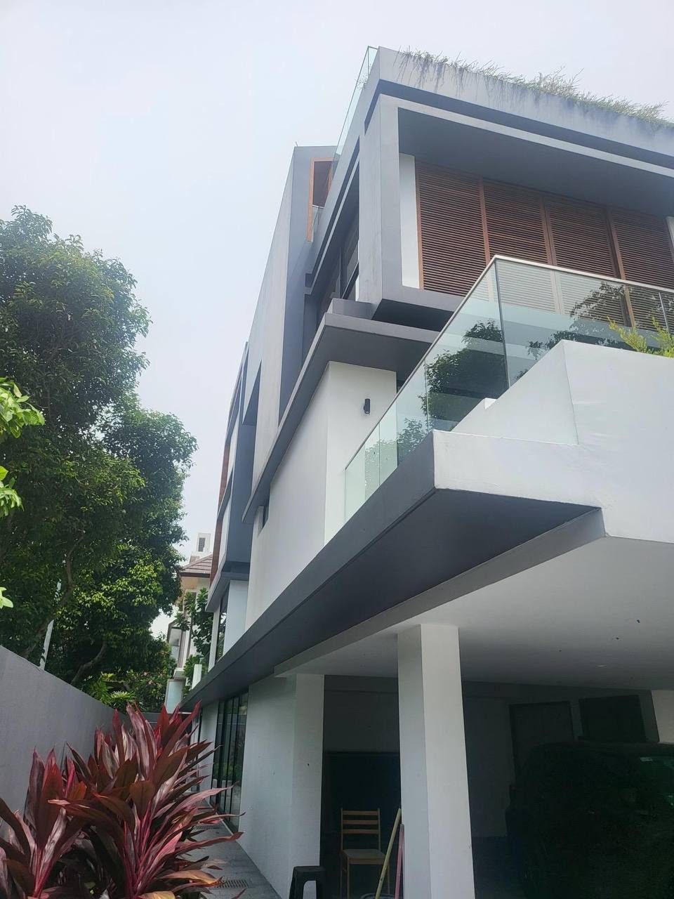 Timber fins and white facade